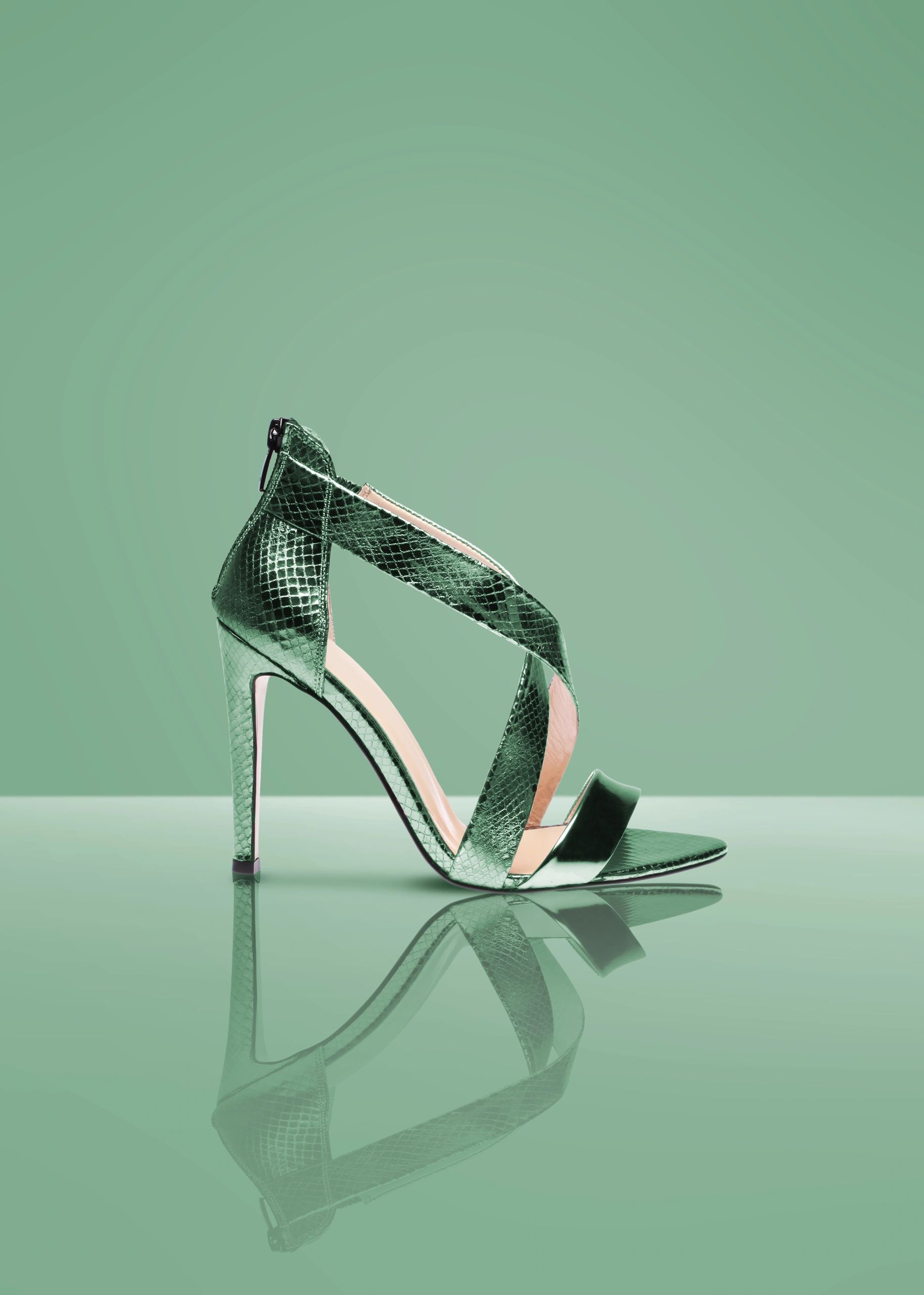 Green statement shoe in a studio editorial setup