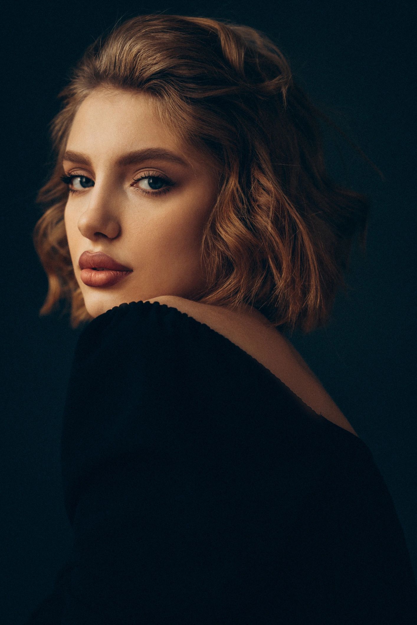 Editorial portrait of a woman with a poised, confident expression