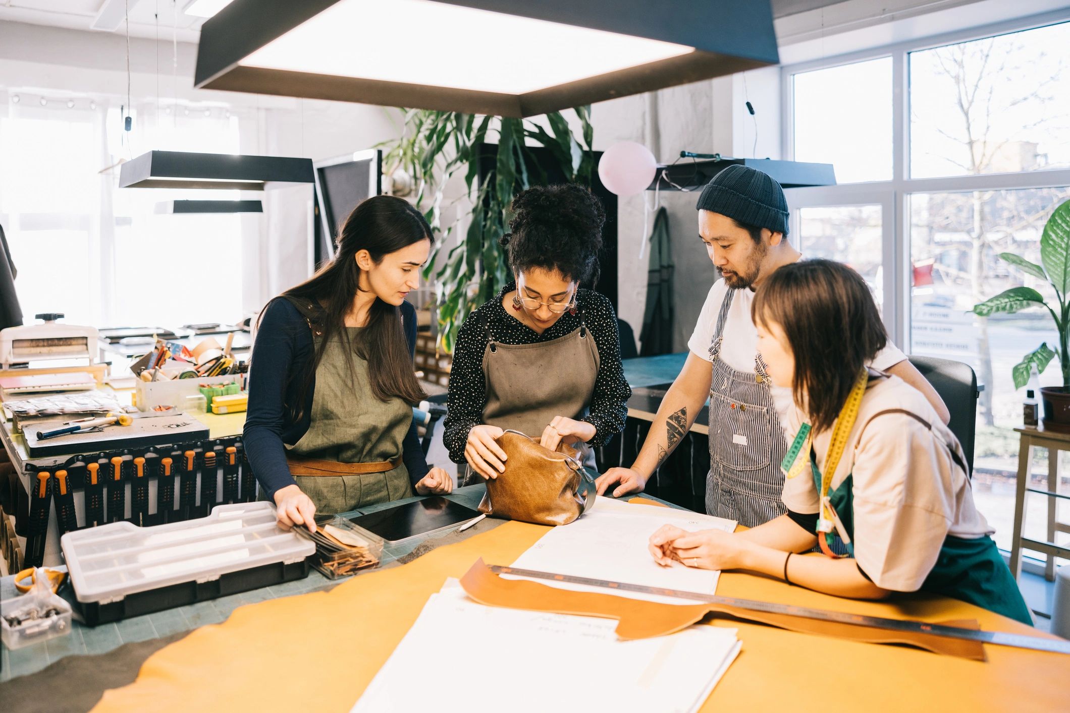 Design team reviewing footwear concepts in a creative studio