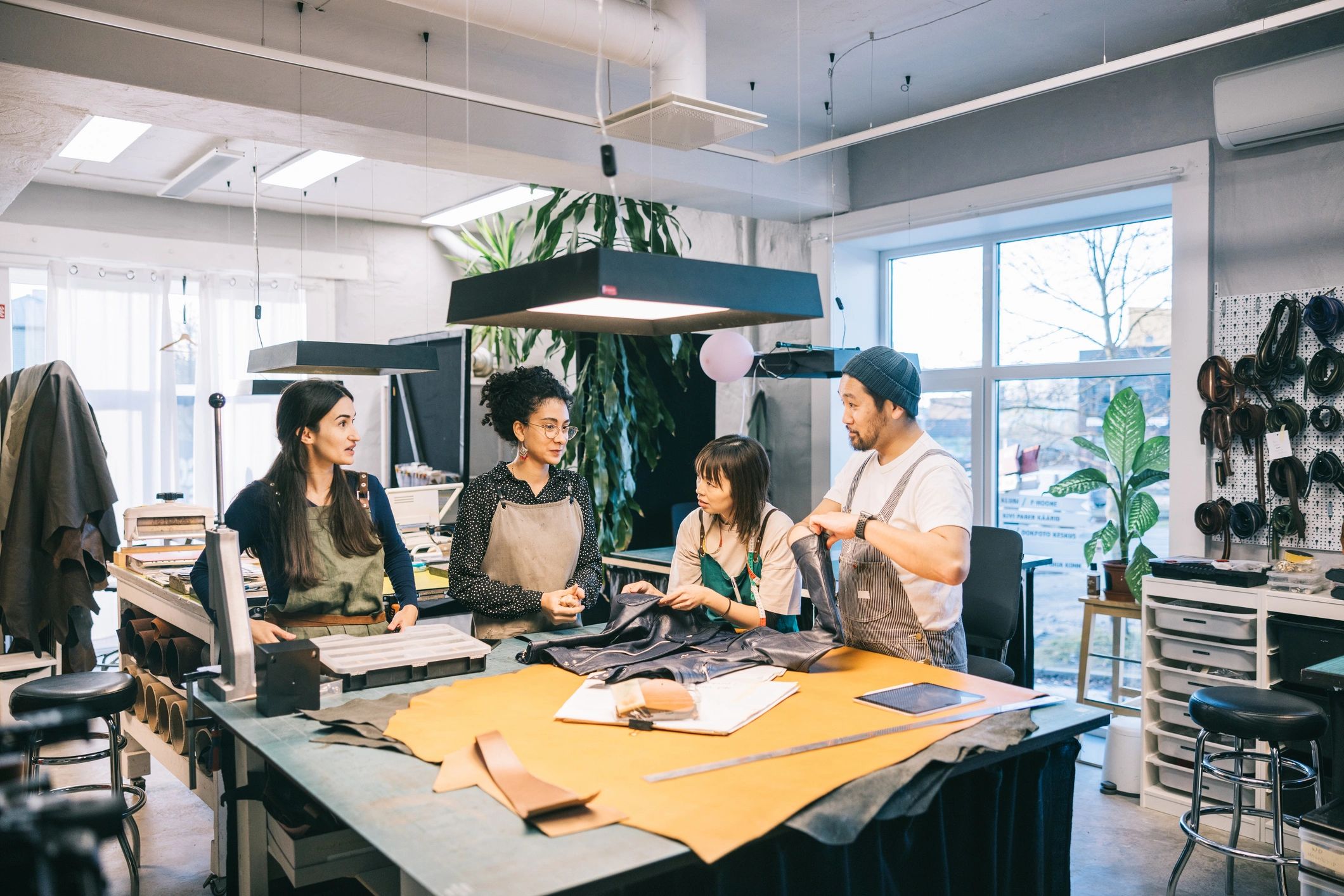 Creative team collaborating in a fashion studio