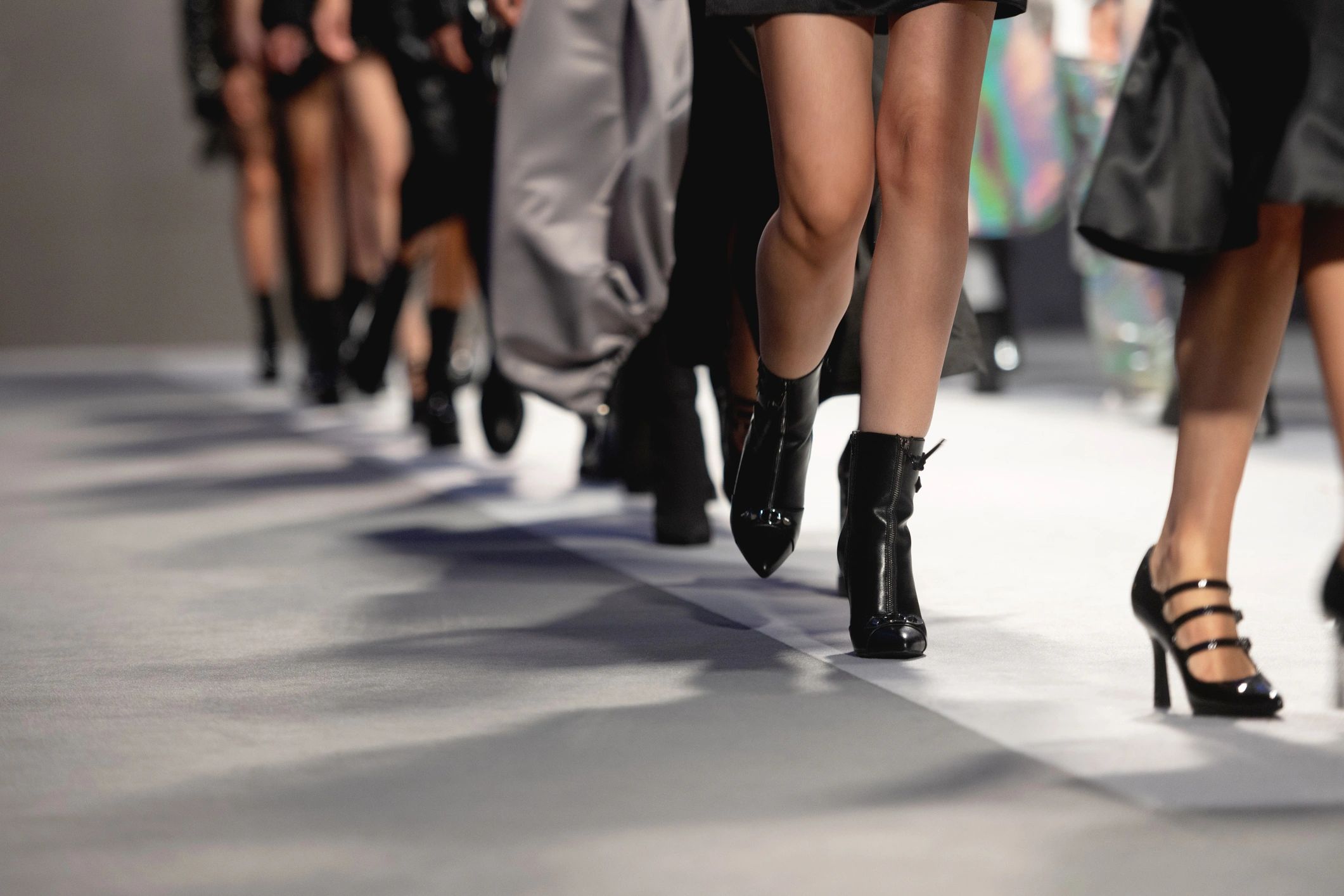 Fashion runway finale with models in formation