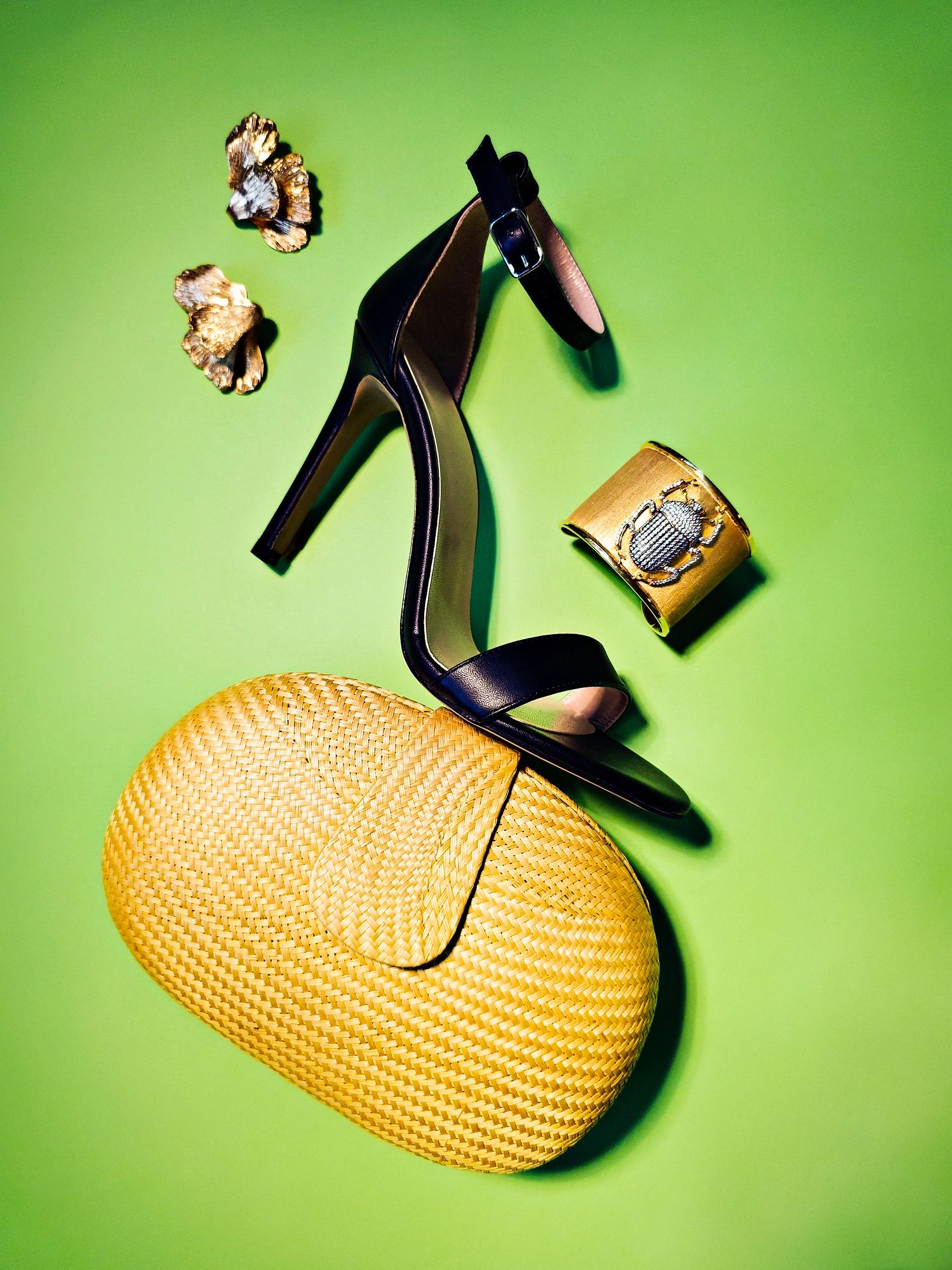 Styled fashion still life with shoe, bag, and jewelry
