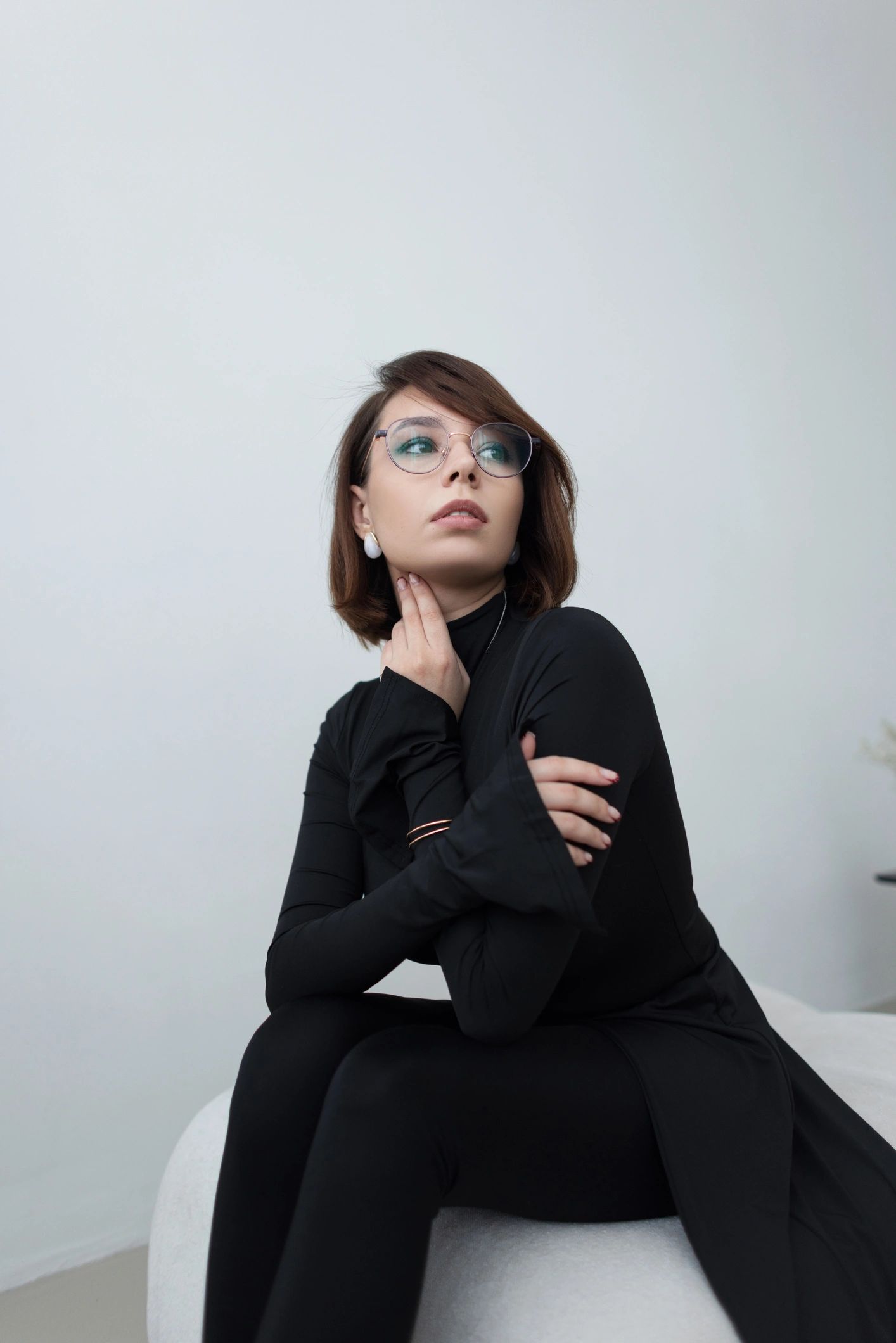 Editorial fashion portrait in a minimalist interior